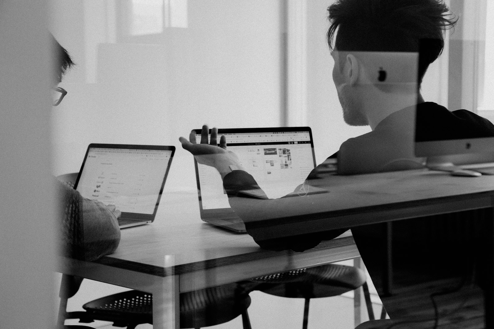 Marketing analyst reviewing growth dashboards and performance metrics at a modern desk