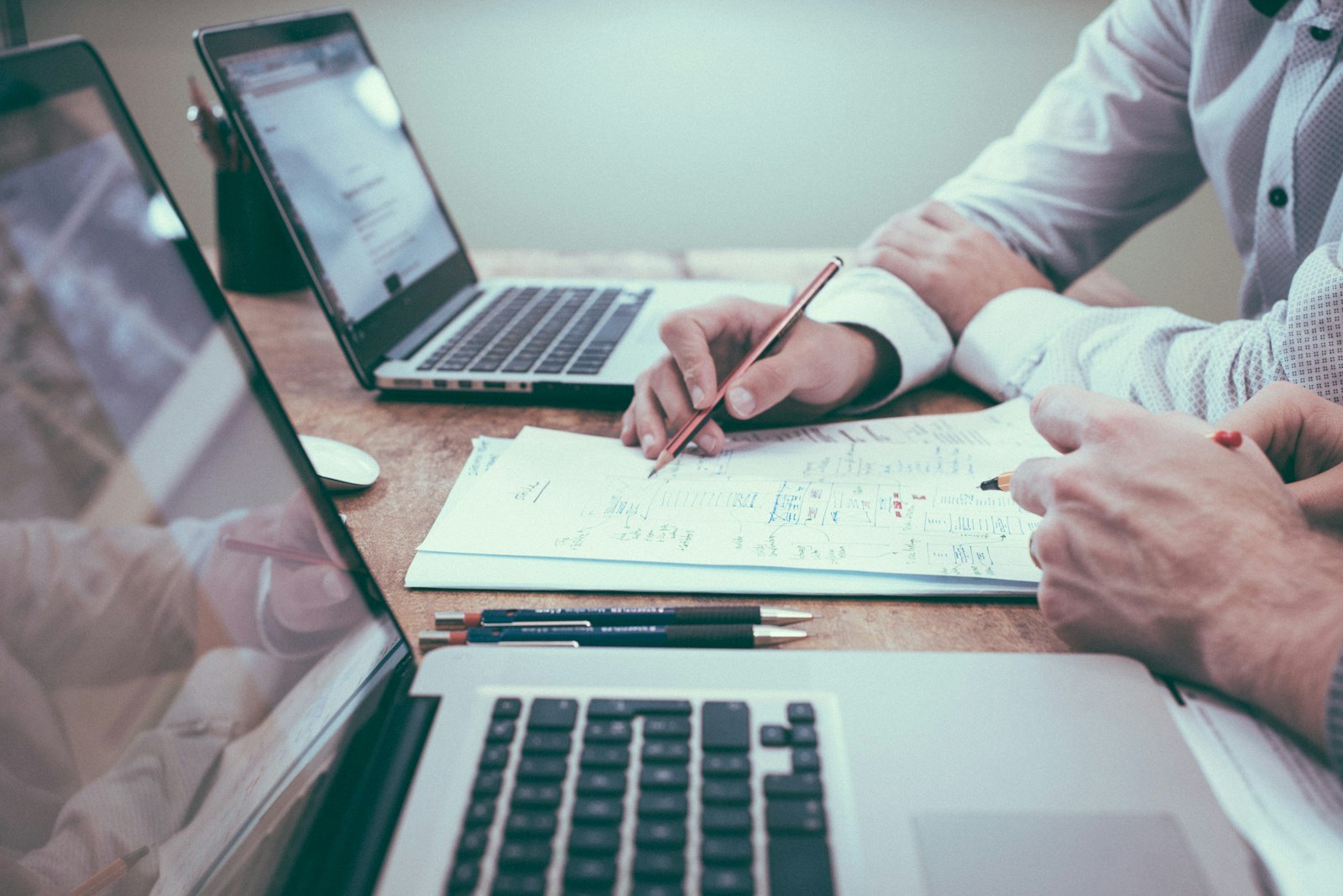 Professional services meeting with documents and strategy notes